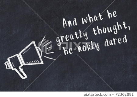 Chalk loudspeaker and wise quote on black desk 72302891