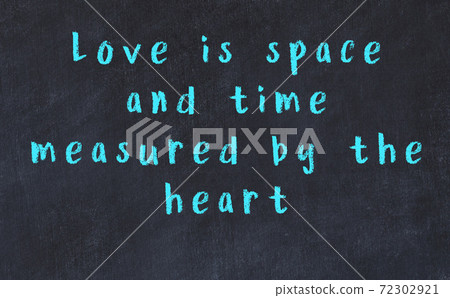 Black chalkboard with wise inscription on it Black chalkboard with wise inscription on it 72302921