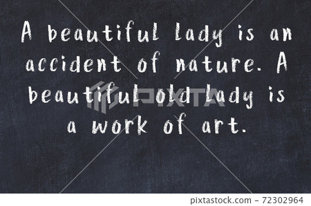 Chalk wise inscription on black chalkboard Chalk wise inscription on black chalkboard 72302964