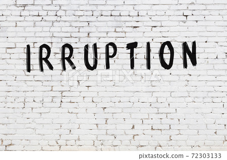 Word irruption painted on white brick wall 72303133