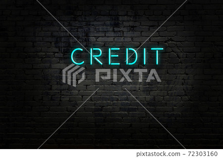 Night view of neon sign on brick wall Night view of neon sign on brick wall 72303160