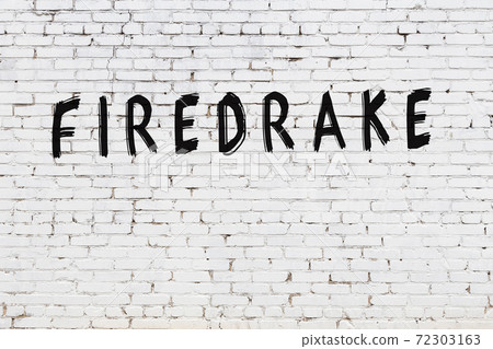 Word firedrake painted on white brick wall Word firedrake painted on white brick wall 72303163