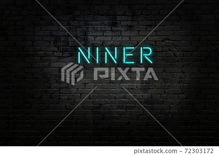 Night view of neon sign on brick wall Night view of neon sign on brick wall 72303172