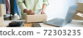Business owner entrepreneur packing cardboard box preparing parcel for shipment, Online marketing.. 72303235