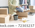 Business owner entrepreneur packing cardboard box preparing parcel for shipment, Online marketing.. 72303237