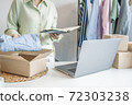 Business owner entrepreneur packing cardboard box preparing parcel for shipment, Online marketing.. 72303238