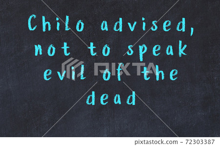Chalk wise inscription on black chalkboard 72303387