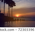 Silhouette swimming pool at sunset with happy tourist on holidays. 72303396