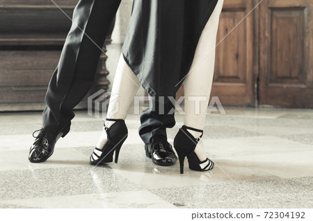 Legs of man and woman dancing Argentine tango 72304192