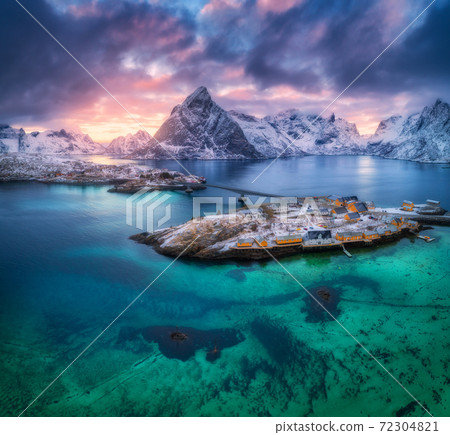 Aerial view of Hamnoy at dramatic sunset in winter in Norway Aerial view of Hamnoy at dramatic sunset in winter in Norway 72304821