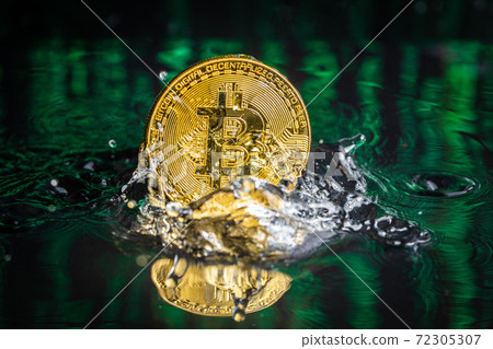 Gold bitcoin coin falling to water. Bitcoin and water splash. Gold bitcoin coin falling to water. Bitcoin and water splash. 72305307