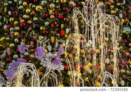 Christmas decorations for the shopping center. artificial Christmas trees, toys and garlands with illumination. cute decor for shopping mall shop windows Christmas decorations for the shopping center. artificial Christmas trees, toys and garlands with illumination. cute decor for shopping mall shop windows 72305380