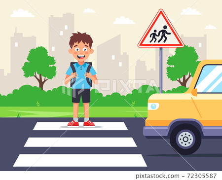 a schoolboy crosses the road on a zebra crossing. a schoolboy crosses the road on a zebra crossing. 72305587
