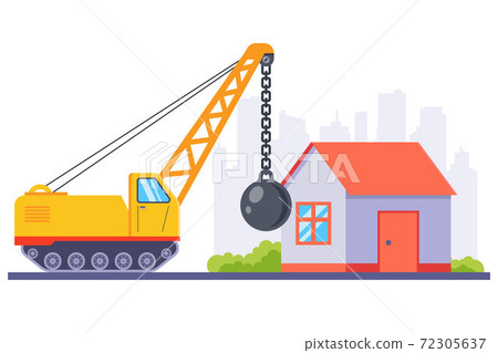 yellow construction machinery demolishes an old house with a large metal ball.  72305637