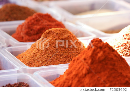 Containers with assorted oriental spices. Containers with assorted oriental spices. 72305692