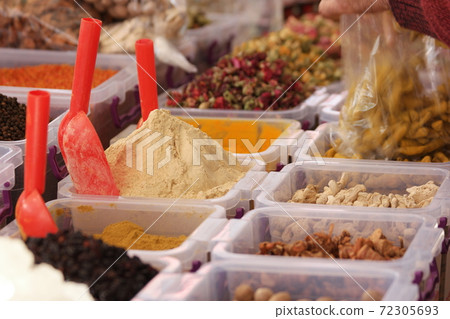 Various oriental spices in plastic boxes. Various oriental spices in plastic boxes. 72305693