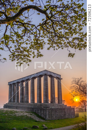View of National Monument of Scotland against sunset on Calton Hill in Edinburgh, Scotland View of National Monument of Scotland against sunset on Calton Hill in Edinburgh, Scotland 72306213
