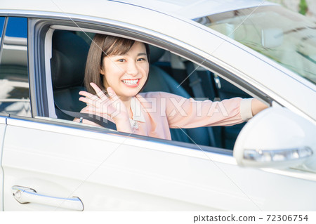 A young woman driving A young woman driving 72306754
