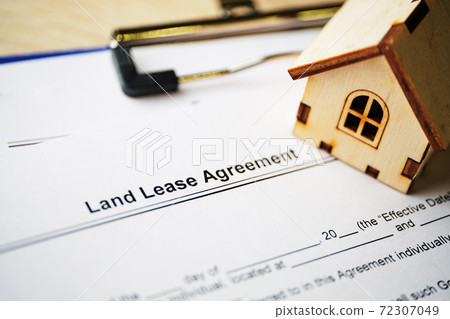 Legal document Land Lease Agreement on paper close up Legal document Land Lease Agreement on paper close up 72307049