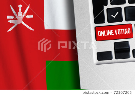 Online voting concept in Sultanate of Oman. Keyboard near country flag Online voting concept in Sultanate of Oman. Keyboard near country flag 72307265