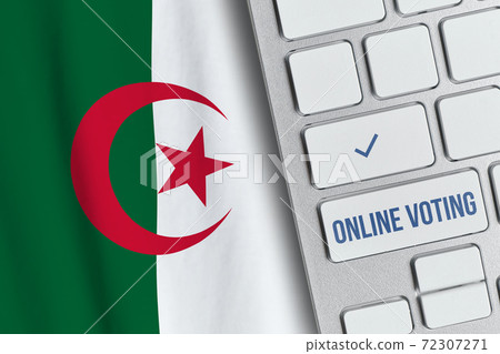 Online voting concept in People Democratic Republic of Algeria. Keyboard near country flag Online voting concept in People Democratic Republic of Algeria. Keyboard near country flag 72307271