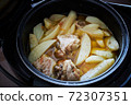 Braised potato with pieces of turkey meat with spices in a pan is ready to eat 72307351