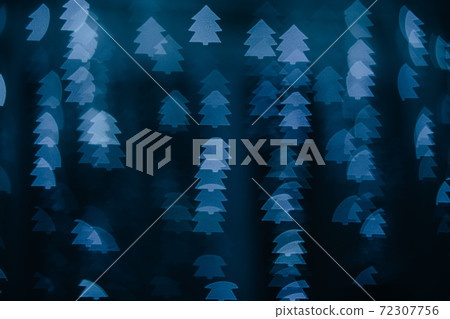 Defocused bokeh lights in shape of blue Christmas tree. Defocused bokeh lights in shape of blue Christmas tree. 72307756