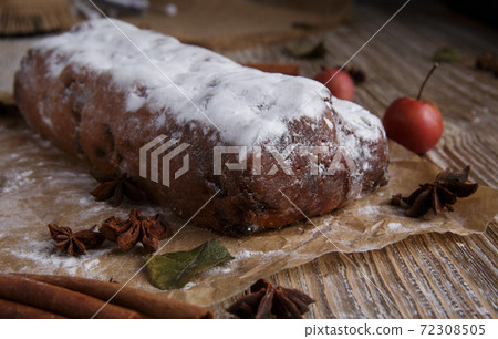 Christmas cupcake, cinnamon and star anise on wooden table. Christmas cupcake, cinnamon and star anise on wooden table. 72308505