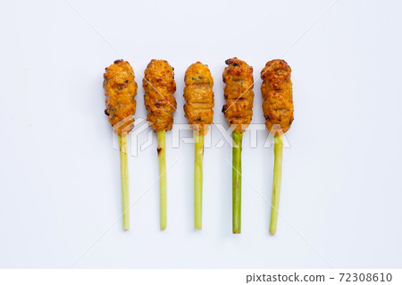 Grilled minced chicken with curry paste and coconut cream on lemongrass skewers. Top view 72308610