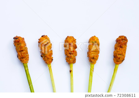 Grilled minced chicken with curry paste and coconut cream on lemongrass skewers. Top view 72308611