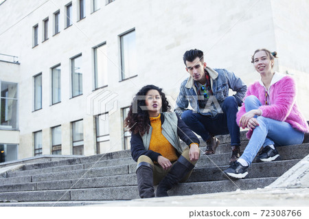 cute group of teenages at the building of university with books huggings, diversity nations real students lifestyle cute group of teenages at the building of university with books huggings, diversity nations real students lifestyle 72308766