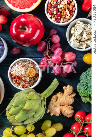 Vegetarian food flat lay. Fruits and vegetables, shot from the top with cheese, legumes and rice Vegetarian food flat lay. Fruits and vegetables, shot from the top with cheese, legumes and rice 72315084