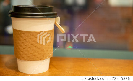 Coffee in a takeaway cup at the cafe Coffee in a takeaway cup at the cafe 72315826