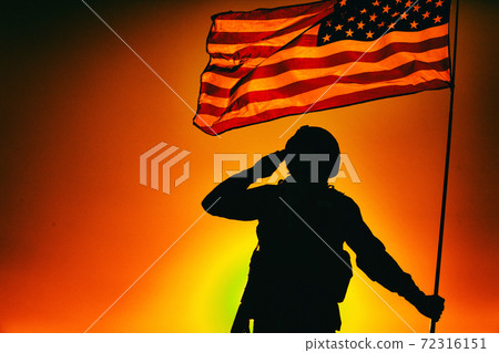 US soldier saluting and honoring fallen heroes 72316151