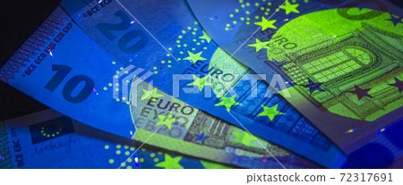 Euro currency in UV light protection.Euro in UV light.Euro currency in UV light protection. 72317691