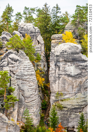 Sandstone rock formation in vibrant autumn forest Sandstone rock formation in vibrant autumn forest 72318453