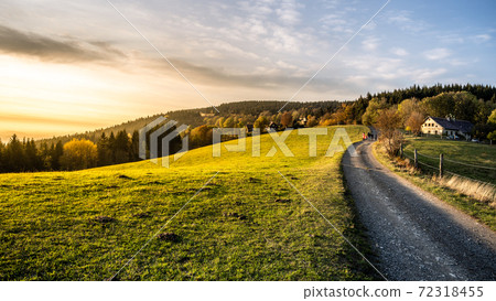 Autumn landscape and country road at sunset time 72318455