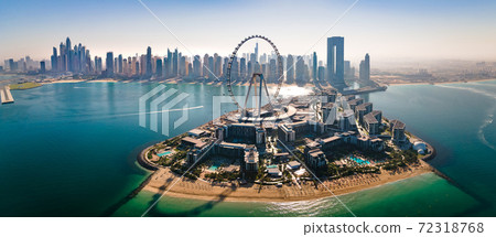 Ain Dubai ferris wheel on Bluewaters island with amazing Dubai skyline in the UAE 72318768