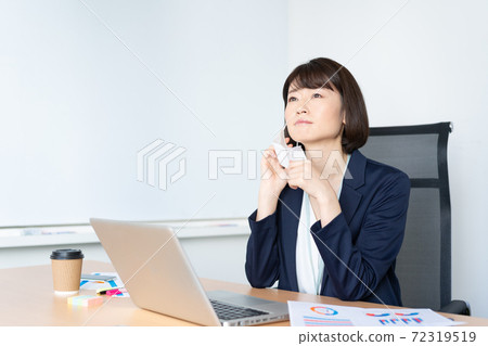 A woman who cares about rough skin because of a mask in the office A woman who cares about rough skin because of a mask in the office 72319519