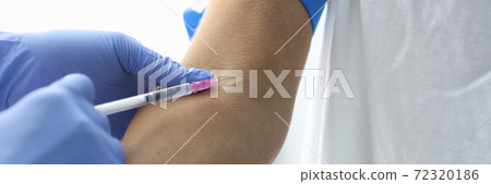 Doctor injects the patient into vein closeup Doctor injects the patient into vein closeup 72320186