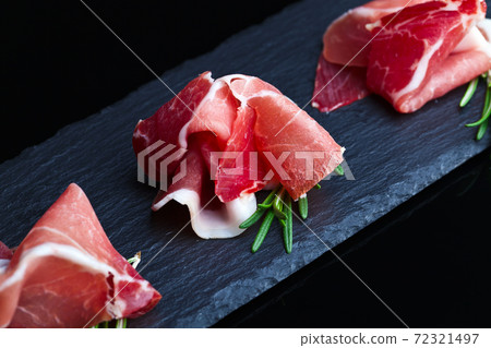 jamon on a black background jamon on a black background 72321497