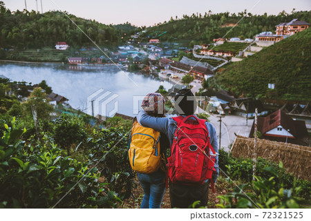 Couple family traveling together on mountain in village countryside on Thailand, at Ban Rak Thai village. Travel relax holiday. 72321525