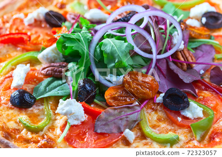 vegan pizza with onion and arugula 72323057