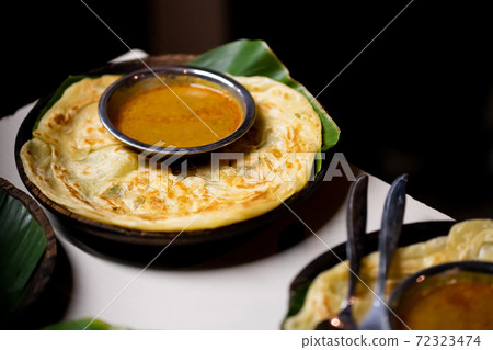 Image of ethnic food, curry and naan 72323474