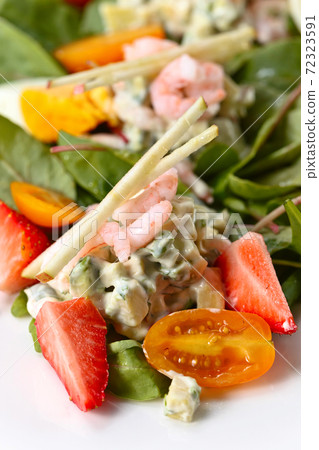 Spring salad with shrimps, egg and strawberry Spring salad with shrimps, egg and strawberry 72323591