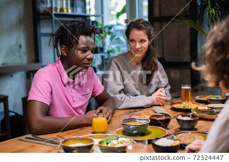 Highschool students having a snack in a modern cafe Highschool students having a snack in a modern cafe 72324447