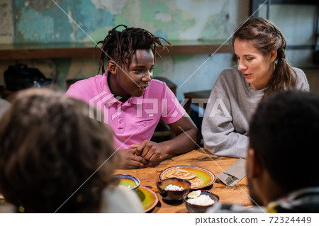Close up of highschool students having a snack in a modern cafe 72324449