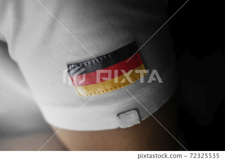 Patch of the national flag of the Germany on a white t-shirt Patch of the national flag of the Germany on a white t-shirt 72325535