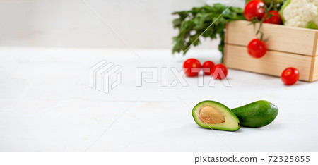 Fresh avocado on white table with space for text. 72325855