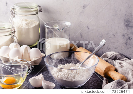Cooking ingredients for dough, eggs, flour, sugar, milk. 72326474